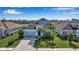 Two-story house with a lake view and landscaped yard at 10527 Falling Leaf Ct, Parrish, FL 34219