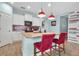 Modern kitchen with granite countertops and red tile backsplash at 10527 Falling Leaf Ct, Parrish, FL 34219