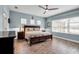 Spacious main bedroom with large windows and a view of the lake at 10527 Falling Leaf Ct, Parrish, FL 34219