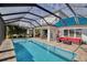 Screened pool and patio with comfortable seating area at 10527 Falling Leaf Ct, Parrish, FL 34219