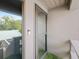 Private balcony with frosted glass door and artificial turf at 1111 N Bayshore Blvd # F6, Clearwater, FL 33759