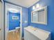 Clean bathroom with light blue walls and white vanity at 1111 N Bayshore Blvd # F6, Clearwater, FL 33759