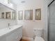 Clean bathroom with a white vanity, toilet, and shower at 1111 N Bayshore Blvd # F6, Clearwater, FL 33759
