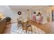 Bright dining room with glass-top table and spiral staircase at 1111 N Bayshore Blvd # F6, Clearwater, FL 33759