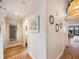 Light-filled hallway with wood floors and access to multiple rooms at 1111 N Bayshore Blvd # F6, Clearwater, FL 33759
