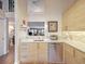 Modern kitchen features light wood cabinets, quartz countertops, and stainless steel appliances at 1111 N Bayshore Blvd # F6, Clearwater, FL 33759