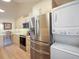 Modern kitchen with stainless steel appliances and white quartz countertops at 1111 N Bayshore Blvd # F6, Clearwater, FL 33759