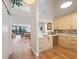 Modern kitchen boasts light wood cabinets, stainless steel appliances, and hardwood floors at 1111 N Bayshore Blvd # F6, Clearwater, FL 33759
