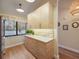 Updated kitchen with light wood cabinets and stainless steel appliances at 1111 N Bayshore Blvd # F6, Clearwater, FL 33759