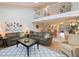 Open living room with two sofas, coffee table, and view to dining area at 1111 N Bayshore Blvd # F6, Clearwater, FL 33759