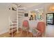 White spiral staircase with wooden steps and pink chairs at 1111 N Bayshore Blvd # F6, Clearwater, FL 33759