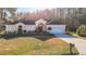 House with a large yard and palm trees, in a wooded area at 11620 Eastern Star Ct, New Port Richey, FL 34654
