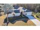 House with a large yard and palm trees, in a wooded area at 11620 Eastern Star Ct, New Port Richey, FL 34654