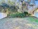 Landscaped backyard with lush greenery and privacy fence at 11620 Eastern Star Ct, New Port Richey, FL 34654