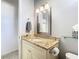 Bathroom with granite countertop, updated vanity, and a mirrored medicine cabinet at 11620 Eastern Star Ct, New Port Richey, FL 34654