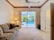 Relaxing bedroom with access to pool and lanai at 11620 Eastern Star Ct, New Port Richey, FL 34654