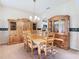 Formal dining room with wood table and hutch at 11620 Eastern Star Ct, New Port Richey, FL 34654