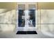White French doors open to a view of the living room at 11620 Eastern Star Ct, New Port Richey, FL 34654