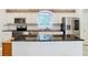 Kitchen boasts granite countertops and stainless steel appliances at 11620 Eastern Star Ct, New Port Richey, FL 34654
