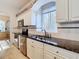 Modern kitchen with granite countertops and stainless steel appliances at 11620 Eastern Star Ct, New Port Richey, FL 34654