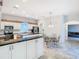 Modern kitchen with granite countertops and white cabinets at 11620 Eastern Star Ct, New Port Richey, FL 34654