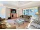 Comfortable living room with ample seating and a large TV at 11620 Eastern Star Ct, New Port Richey, FL 34654