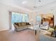 Bright living room featuring ample seating and natural light at 11620 Eastern Star Ct, New Port Richey, FL 34654