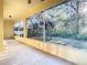 Screened porch overlooking a private backyard with trees at 11620 Eastern Star Ct, New Port Richey, FL 34654
