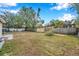 Large backyard with mature trees and wooden fence at 1230 32Nd N St, St Petersburg, FL 33713