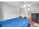 Comfortable bedroom with blue bedding and ceiling fan at 1230 32Nd N St, St Petersburg, FL 33713