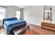 Spacious bedroom with blue bedding and wood flooring at 1230 32Nd N St, St Petersburg, FL 33713
