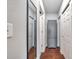 Long hallway with gray cabinet and wood flooring at 1230 32Nd N St, St Petersburg, FL 33713