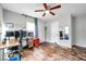 Home office featuring wood floors, ceiling fan, and dual computer stations at 1230 32Nd N St, St Petersburg, FL 33713