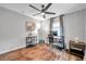 Spacious home office with wood floors, ceiling fan, and built-in shelving at 1230 32Nd N St, St Petersburg, FL 33713