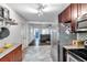 Kitchen with stainless steel appliances and view to living room at 1230 32Nd N St, St Petersburg, FL 33713