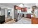 Modern kitchen with stainless steel appliances and dark wood cabinets at 1230 32Nd N St, St Petersburg, FL 33713