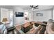 Open living room with a comfortable sectional sofa and view into kitchen at 1230 32Nd N St, St Petersburg, FL 33713