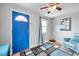 Living room with blue accent wall and hardwood floors at 1230 32Nd N St, St Petersburg, FL 33713
