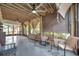Spacious screened porch with ceiling fans and comfortable seating at 1230 32Nd N St, St Petersburg, FL 33713