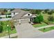 Two-story house, three car garage, and nicely landscaped yard at 12314 Bay Estuary Bnd, Riverview, FL 33579