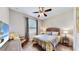 Bedroom with a queen-size bed and TV at 12314 Bay Estuary Bnd, Riverview, FL 33579