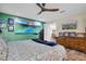 Large main bedroom with a king-size bed and large artwork at 150 Sage Rd, Crystal Beach, FL 34681