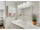 Bright bathroom with vanity, quartz countertop and medicine cabinet at 22 Penzance Ct, Safety Harbor, FL 34695