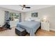 Main bedroom with ceiling fan and large window at 22 Penzance Ct, Safety Harbor, FL 34695