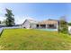 Large backyard with a spacious pool and grassy lawn at 2250 Rio De Janeiro Ave, Punta Gorda, FL 33983