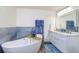 Relax in this spa-like bathroom, featuring a large soaking tub and double vanity at 2250 Rio De Janeiro Ave, Punta Gorda, FL 33983