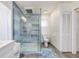 Contemporary bathroom with walk-in shower, tile flooring, and updated fixtures at 2250 Rio De Janeiro Ave, Punta Gorda, FL 33983