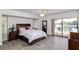 Bedroom with sliding glass doors opening to pool area at 2250 Rio De Janeiro Ave, Punta Gorda, FL 33983