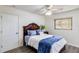 Cozy bedroom with double bed, dresser, and ceiling fan at 2250 Rio De Janeiro Ave, Punta Gorda, FL 33983