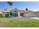 Single-story home with terracotta roof, attached garage, and landscaped lawn at 2250 Rio De Janeiro Ave, Punta Gorda, FL 33983